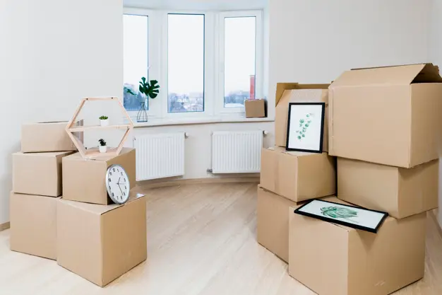 stack-moving-cardboard-boxes-new-apartment_23-2148060032
